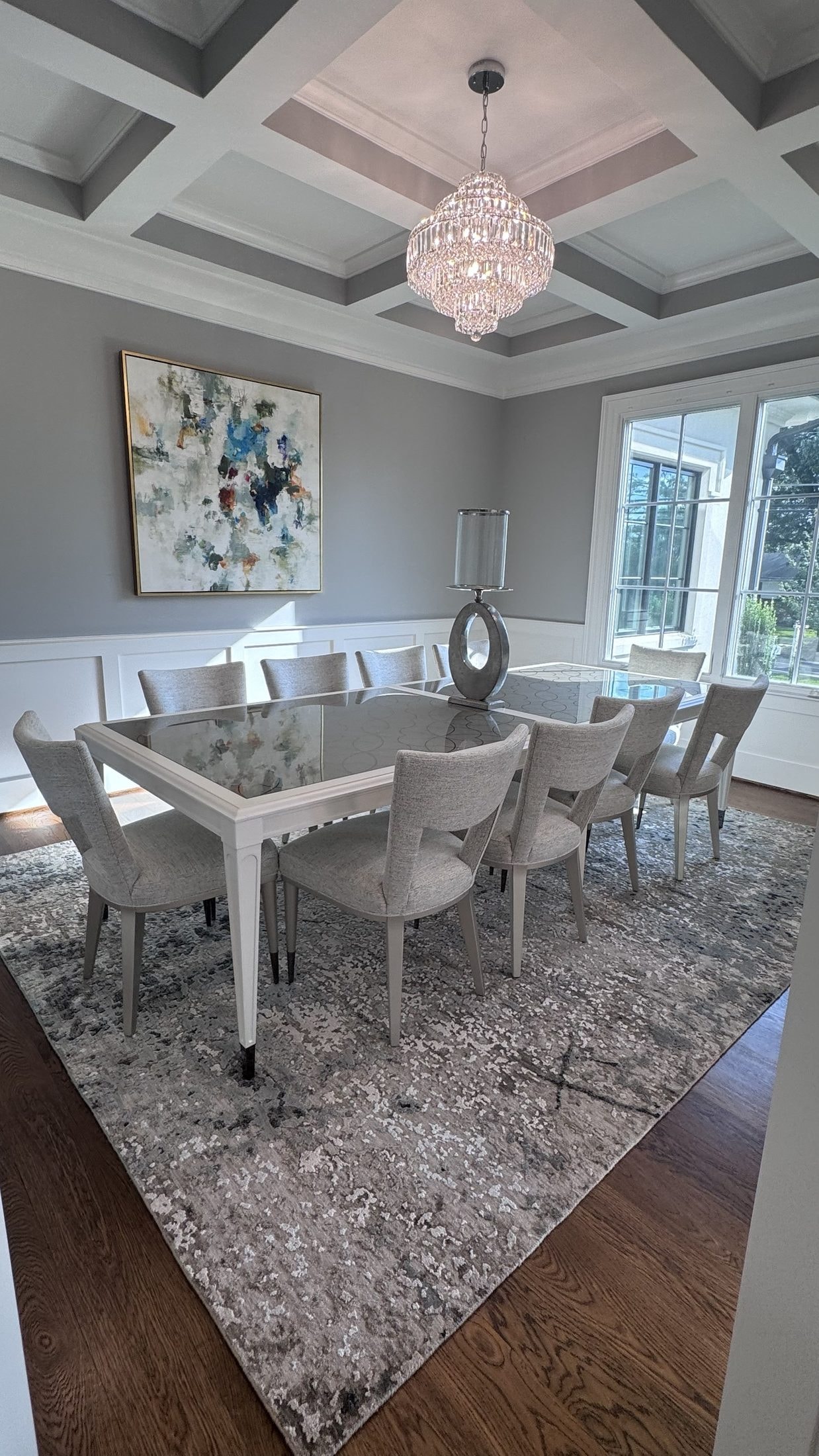 Coffered Dining Room: crystal chandelier, abstract art, handmade rug, designed and furnished by John Hashempour