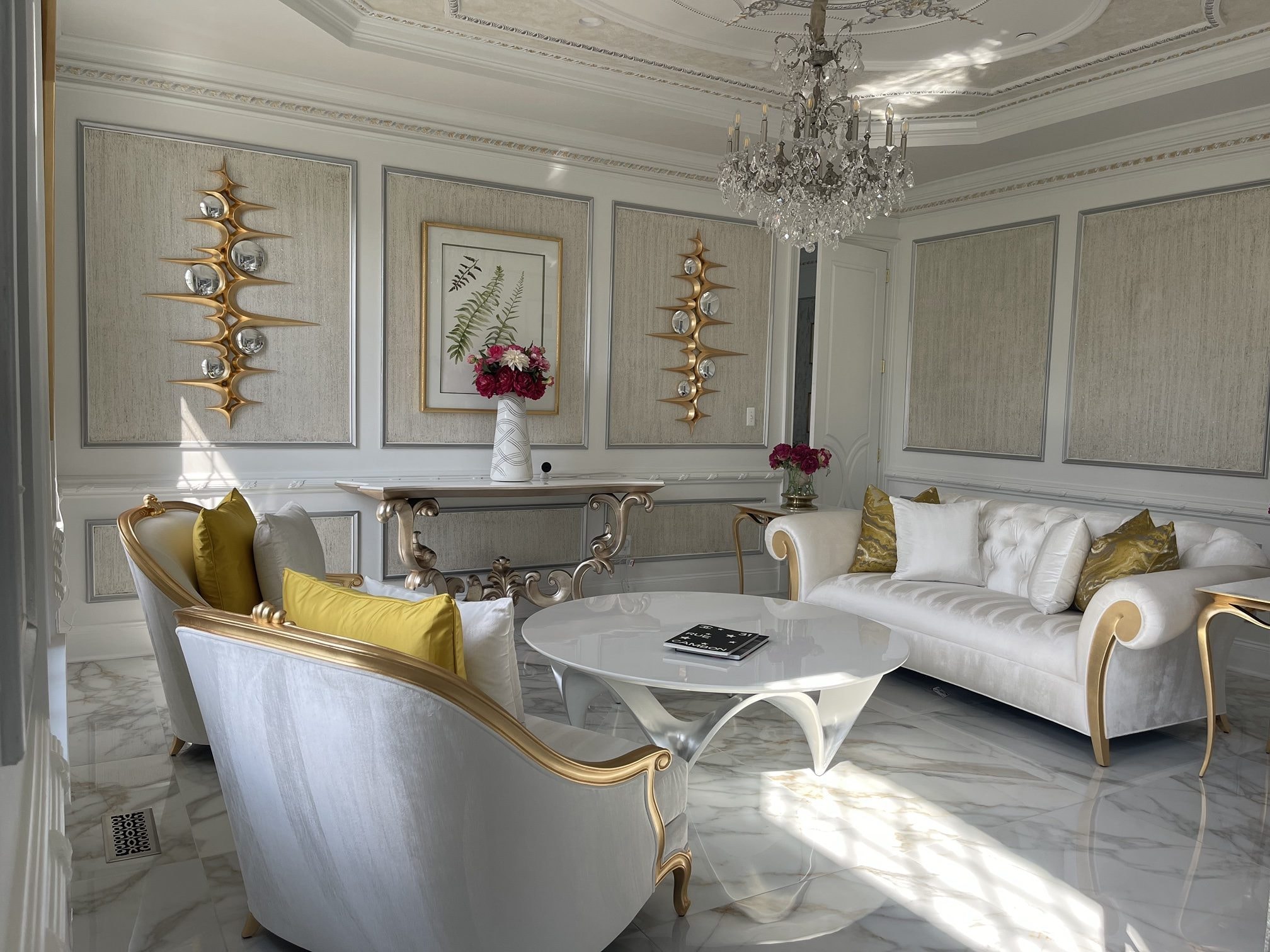 The Gold Parlor: gold-leaf frames, tufted velvet, sculptural wall art, designed and furnished by John Hashempour
